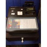 A Sharp XE-A217B electronic cash register complete with key