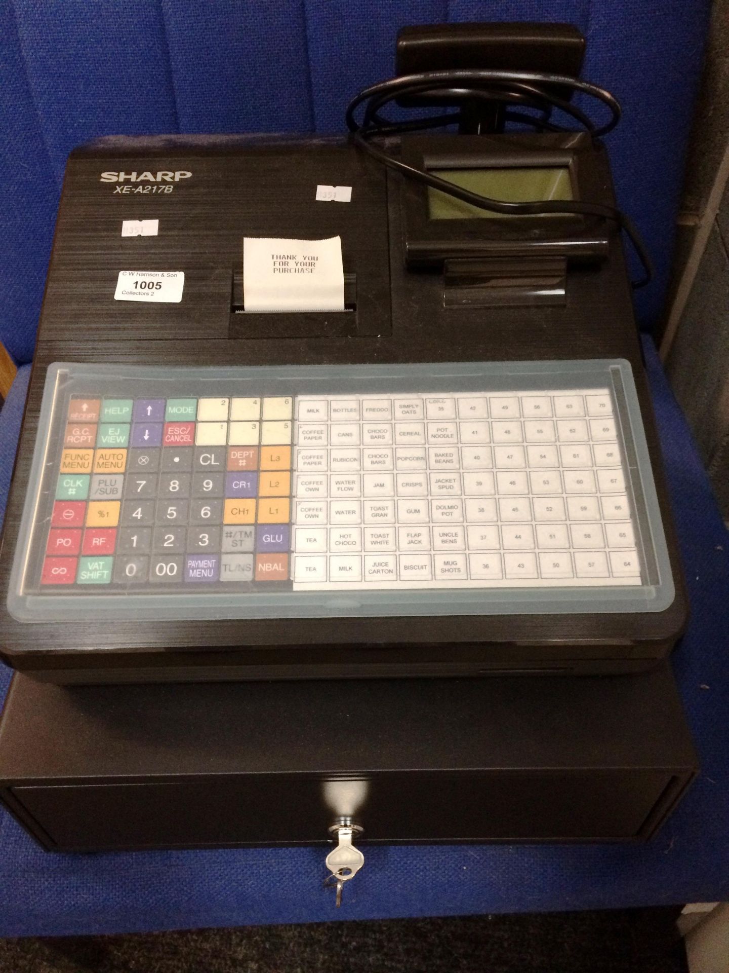 A Sharp XE-A217B electronic cash register complete with key