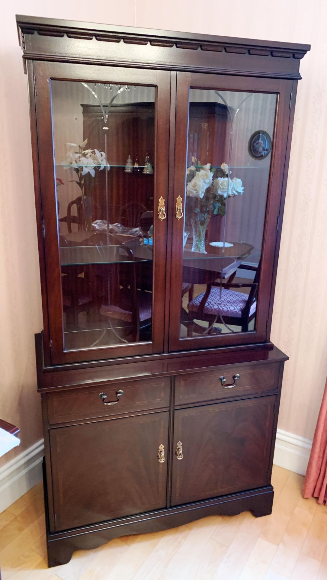 A Strongbow Furniture mahogany finish wall unit with two upper glazed doors with two glass shelves