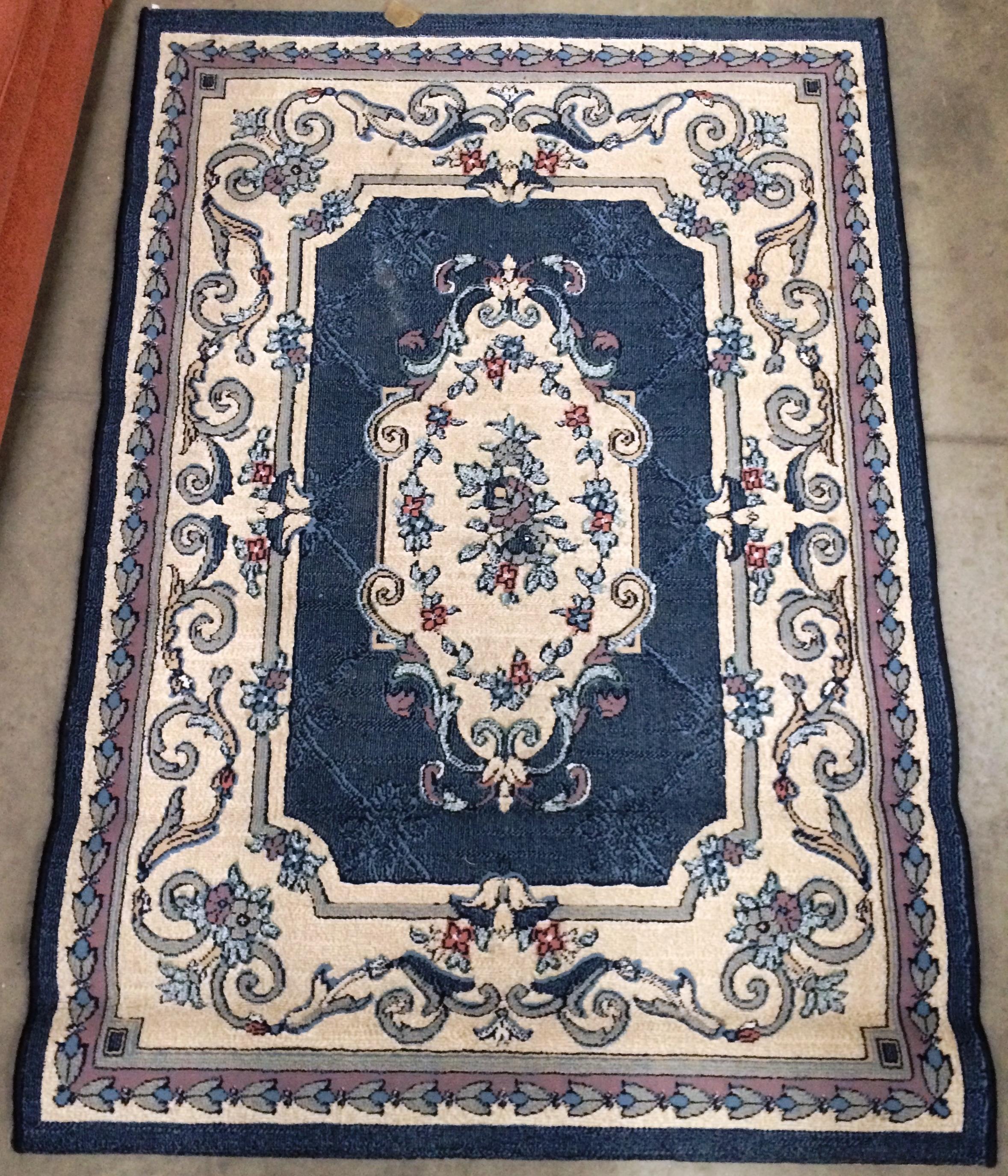 A blue patterned rug 115 x 150cm