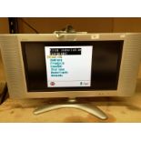 A Sharp Aquos 22" colour TV complete with remote control