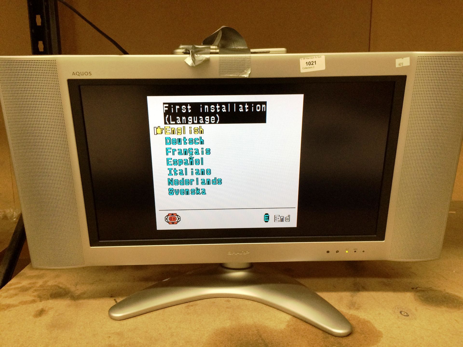 A Sharp Aquos 22" colour TV complete with remote control