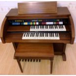 A Lowrey Holiday D325 electronic organ in mahogany finish case 117cm 240v complete with stool,