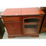 A mahogany finish two door (one glazed),