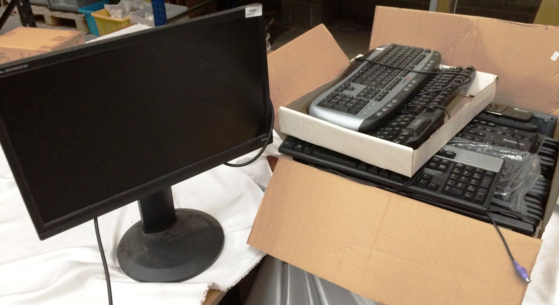 An Iiyama Prolite B228 OHS 22" monitor and a box containing 27 assorted keyboards *please note this