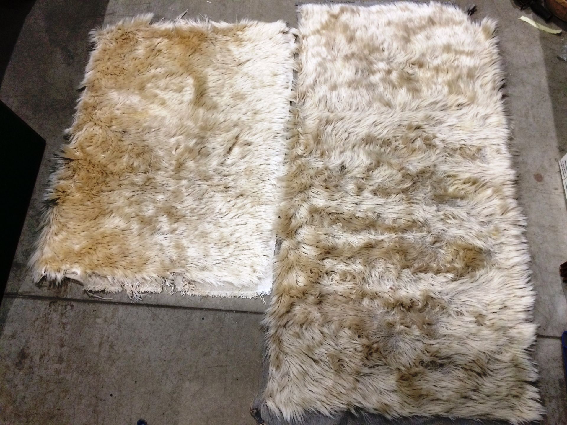 Two sheepskin style rugs one 160 x 80cm and one 110 x 80cm