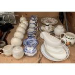 Eight pieces of Denby Monsoon tableware including five jars with covers,