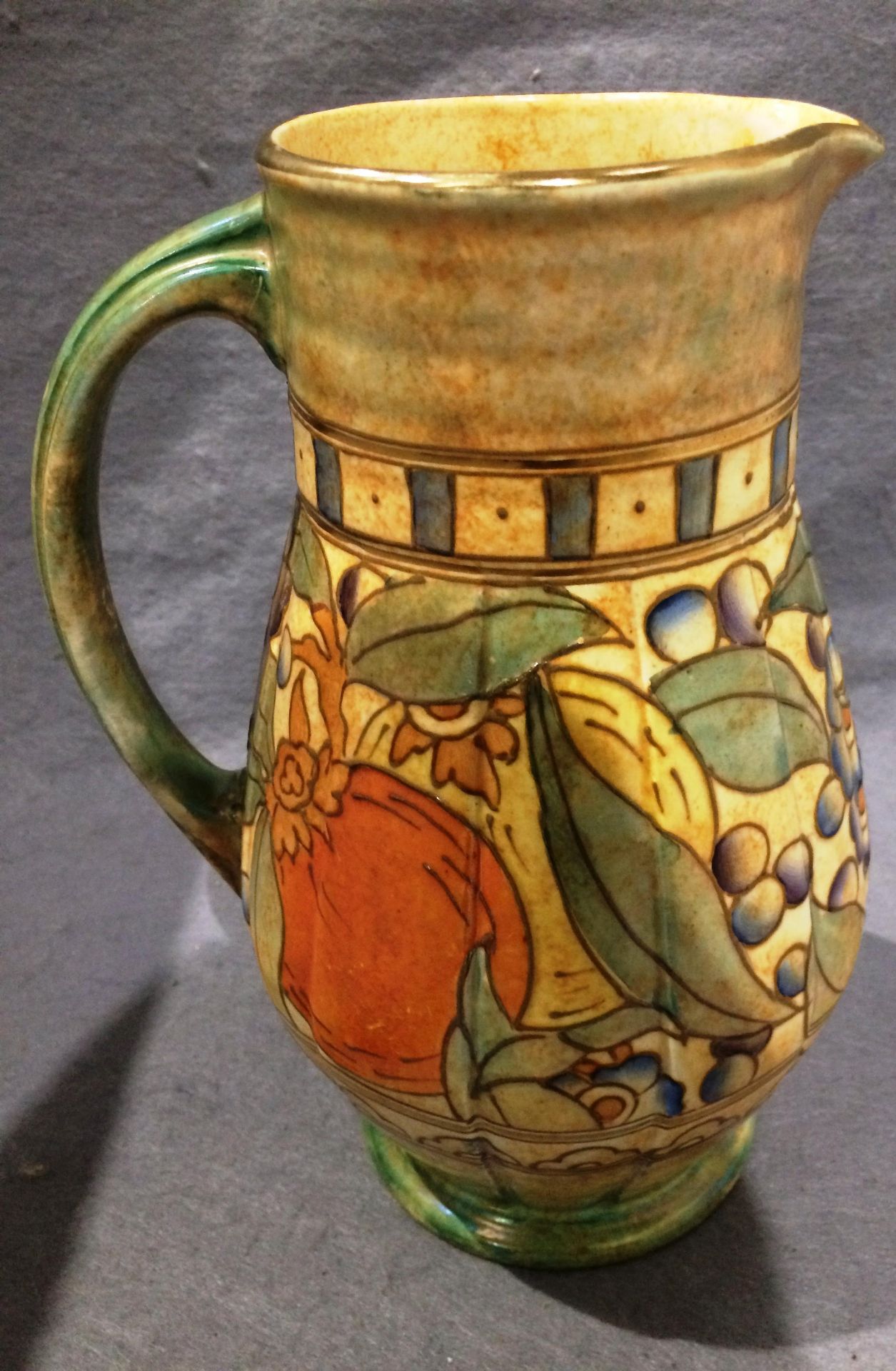 A Charlotte Rhead England Bursley ware fruit patterned jug Ref No. 653 ...