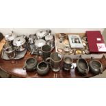 Contents to part table top two stainless steel tea services, pewter tankards and bowls,
