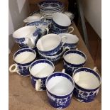 Twenty eight pieces of blue and white and willow pattern tea cups and saucers etc.