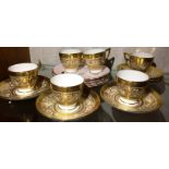 Six Minton gold patterned cups and saucers and six English bone china pink plates with gilt rims