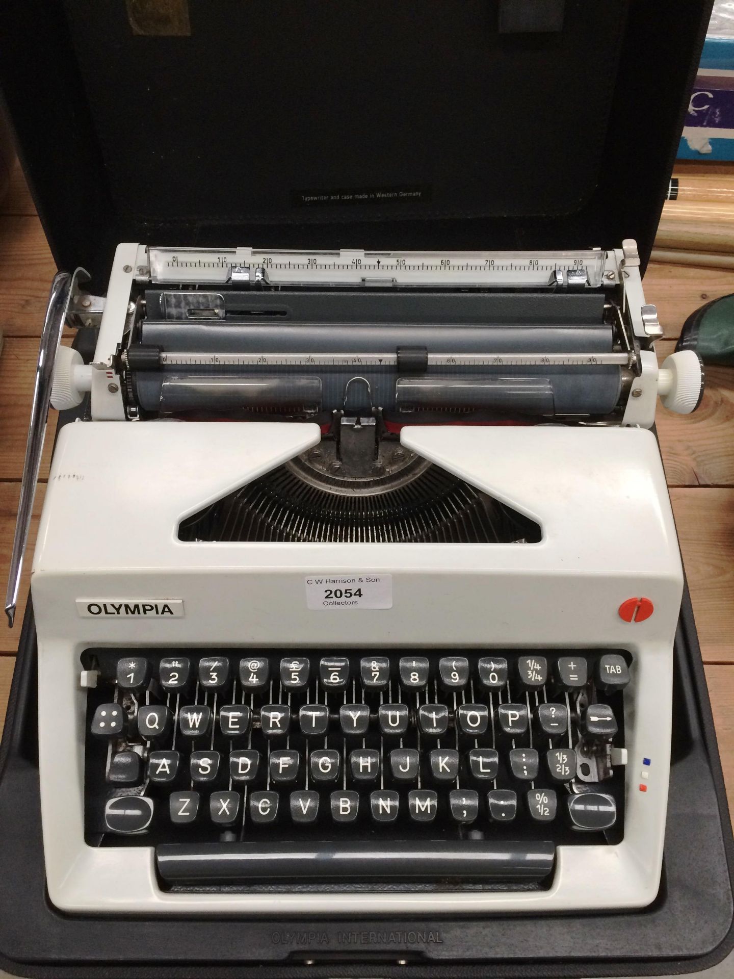 An Olympia International portable typewriter in case