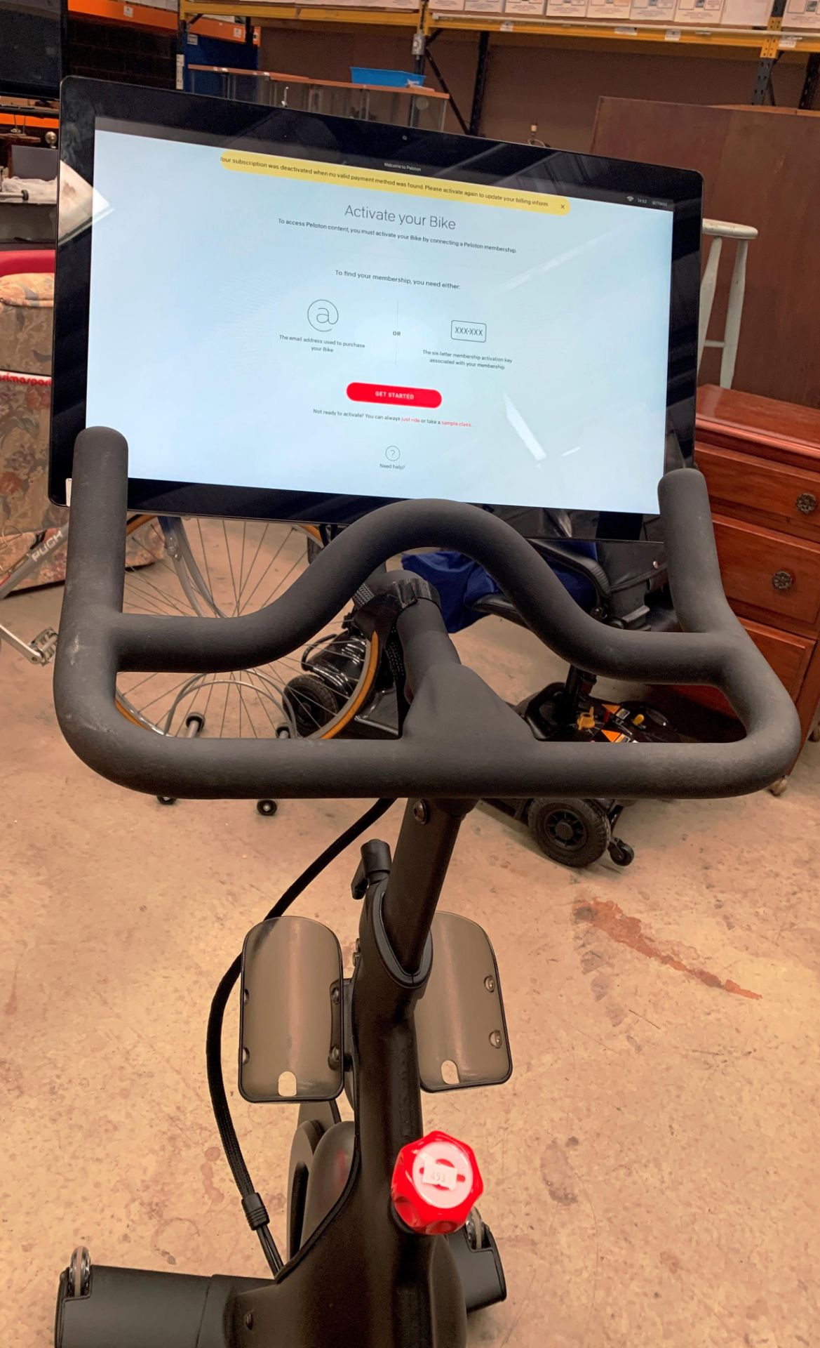 A PELOTON TRAINING BIKE with Peloton console model PLTN-RB1VQ complete with power lead and lock -