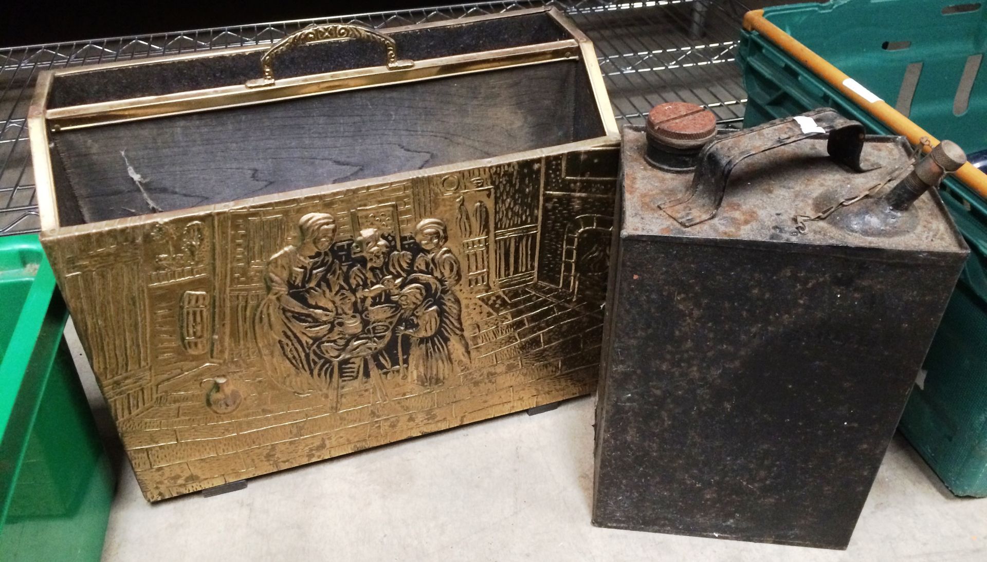 Black vintage petroleum can and a brass and wooden magazine holder