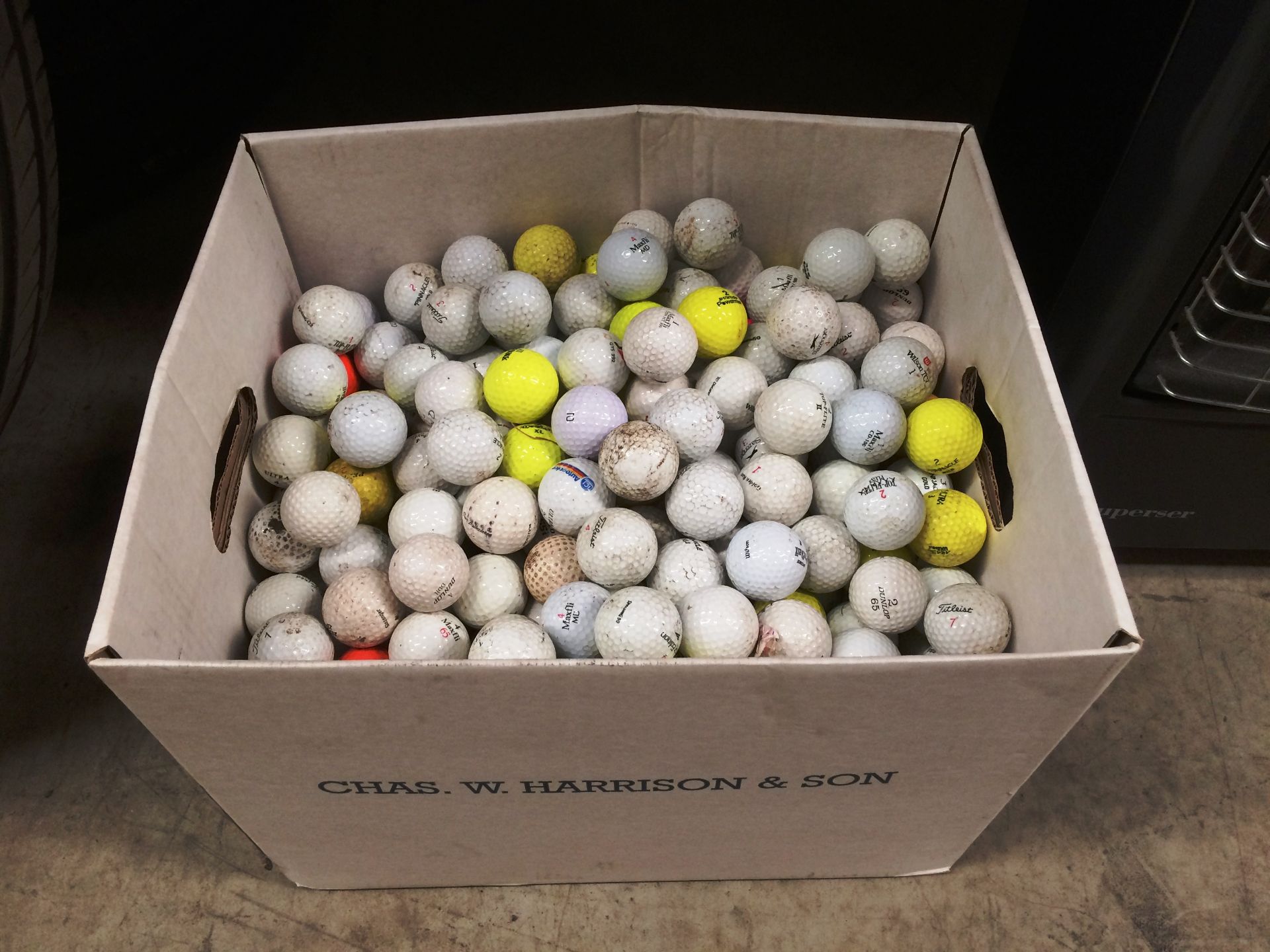 Contents to box an extremely large quantity of second hand golf balls