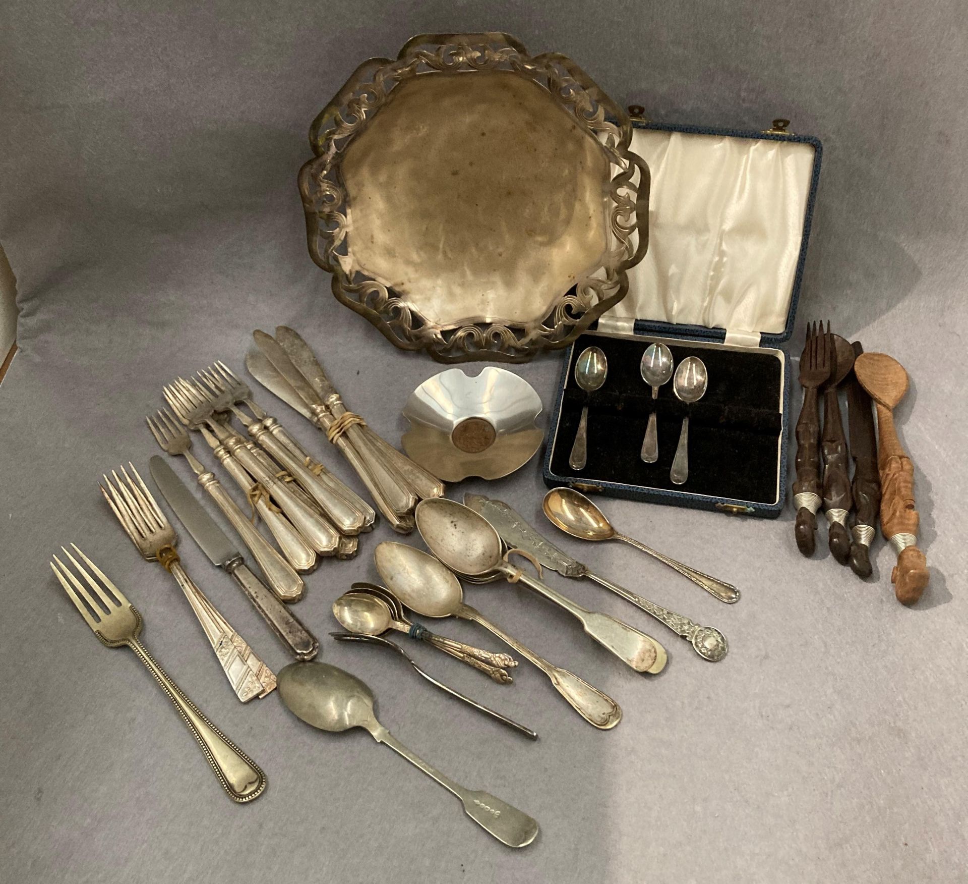 Contents to tray - plated dish and a quantity of plated cutlery