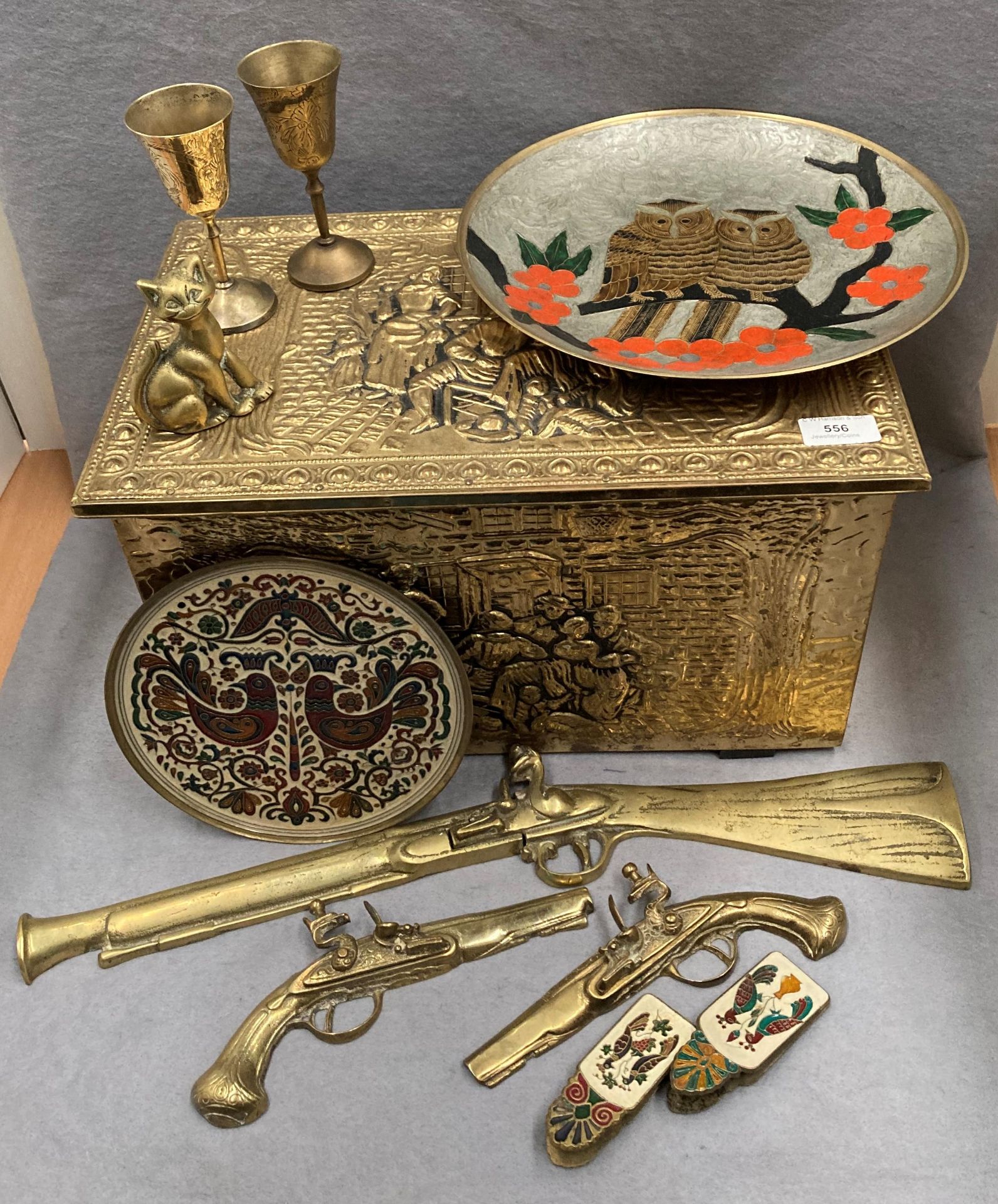 Decorative brass coal box and contents - three brass wall mounting dummy pistols, trays, goblets,