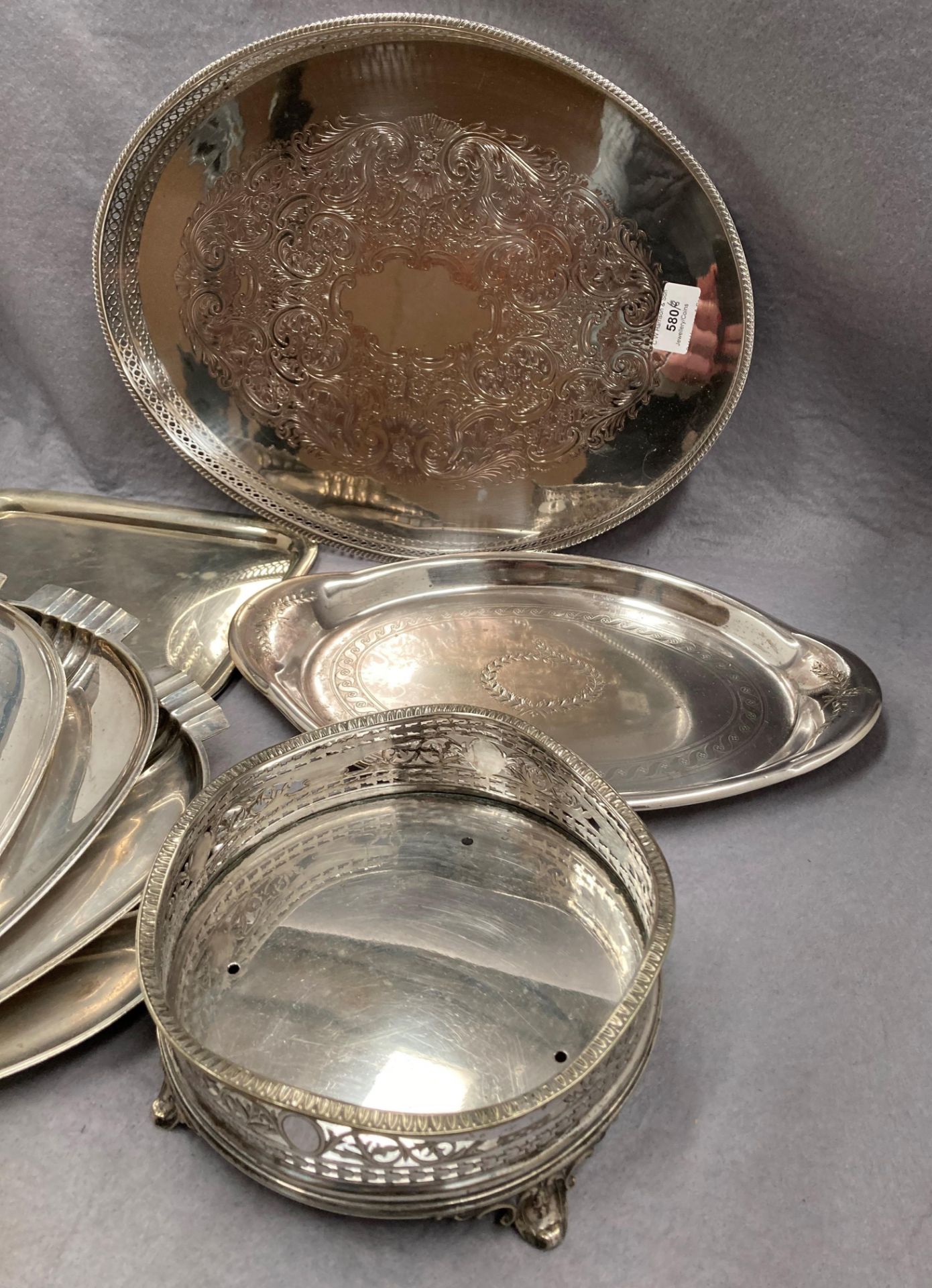 An oval plated gallery tray with pierced rim, four plated trays, - Image 2 of 3