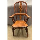 A nineteenth century broad arm Windsor chair
