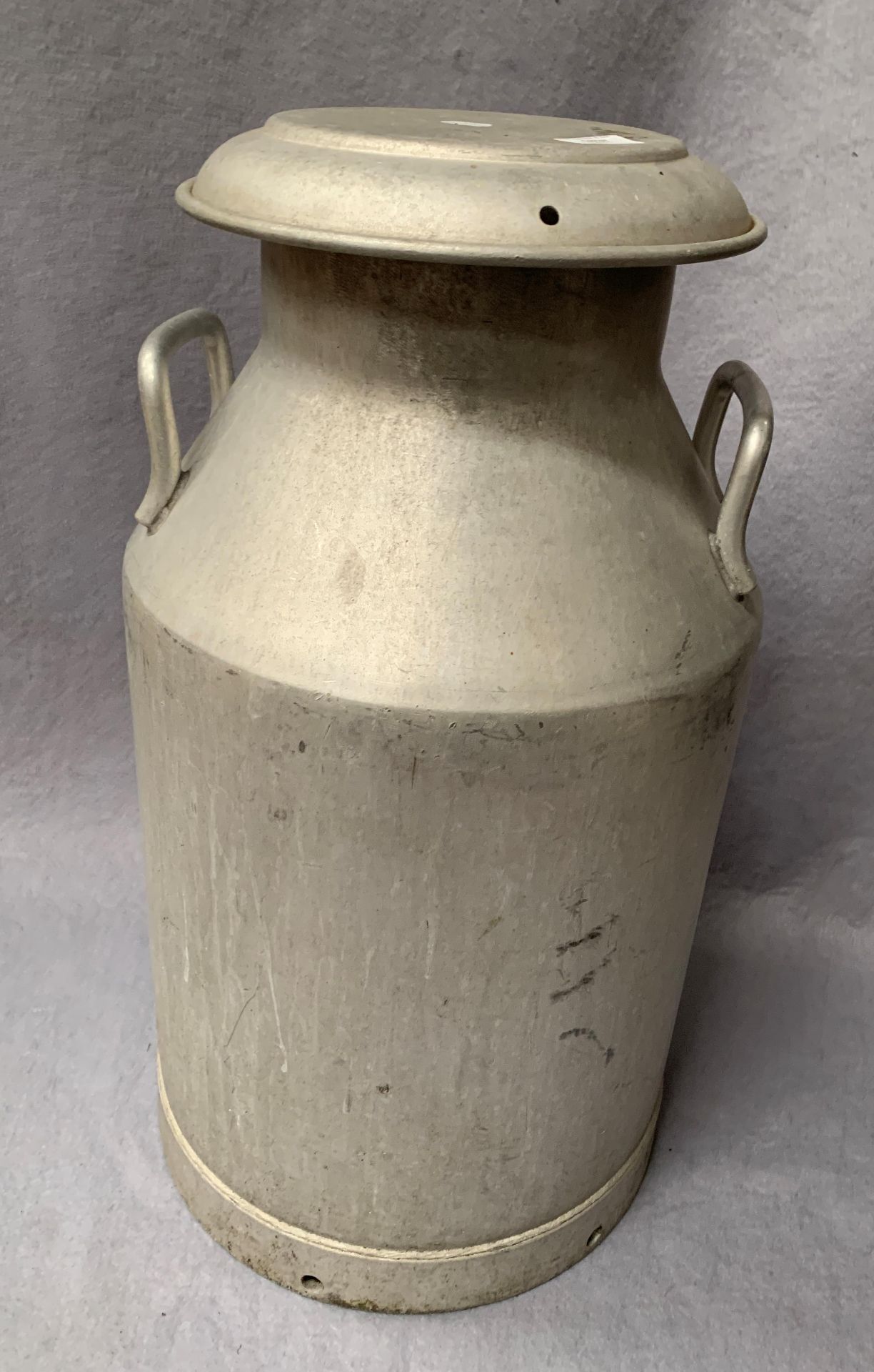 A galvanised two handled milk churn with lid 78cm high