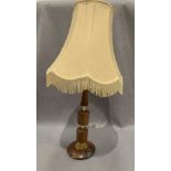 A mid 20th teak and brass table lamp complete with shade - 80cm - flex cut off not tested