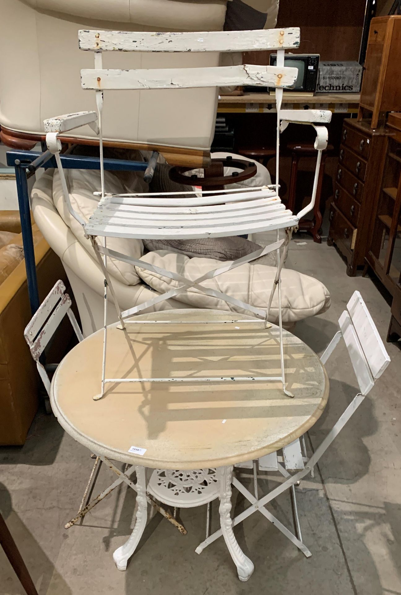 A white painted reproduction metal Britannia table with circular composition top 80cm and three