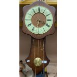 A pendulum wall clock on oak frame 54cm