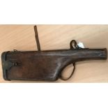 A brown leather leg of Mutton gun case
