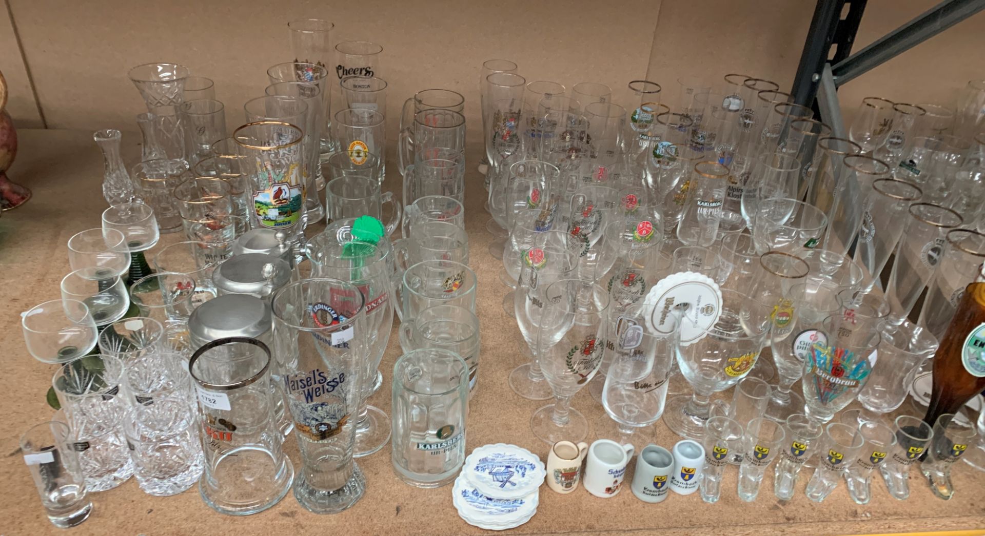 Contents to part of rack a large quantity of German beer drinking glasses - in various shapes and