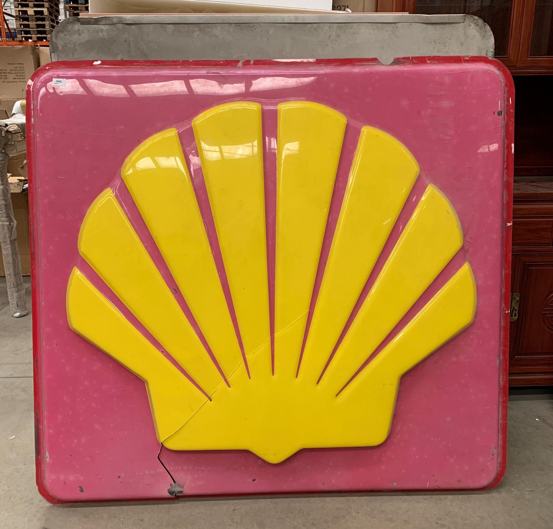 A large plastic Shell petrol illuminating sign on metal frame (please note large crack to plastic)