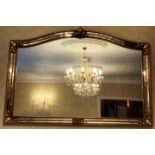 An ornate gilt framed arch top mirror 90 x 128cm