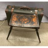 An ebonised stool with shell patterned curved top and a small dark brown fibre suitcase (2)
