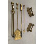 Four large brass fireside tools and two tool rests (6)