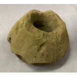 A Quorn stone base for mixing flour 32cm diameter (mixing hole 14cm diameter) possibly Anglo Saxon