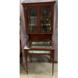 An Edwardian inlaid mahogany Bijouterie cabinet with two upper glazed doors over display cabinet 70