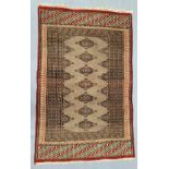 A geometric patterned prayer mat beige and blue on red ground 62 x 95cm