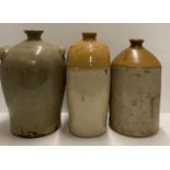 Three large light brown glazed stoneware flagon's and water bottles one labelled Findlater and