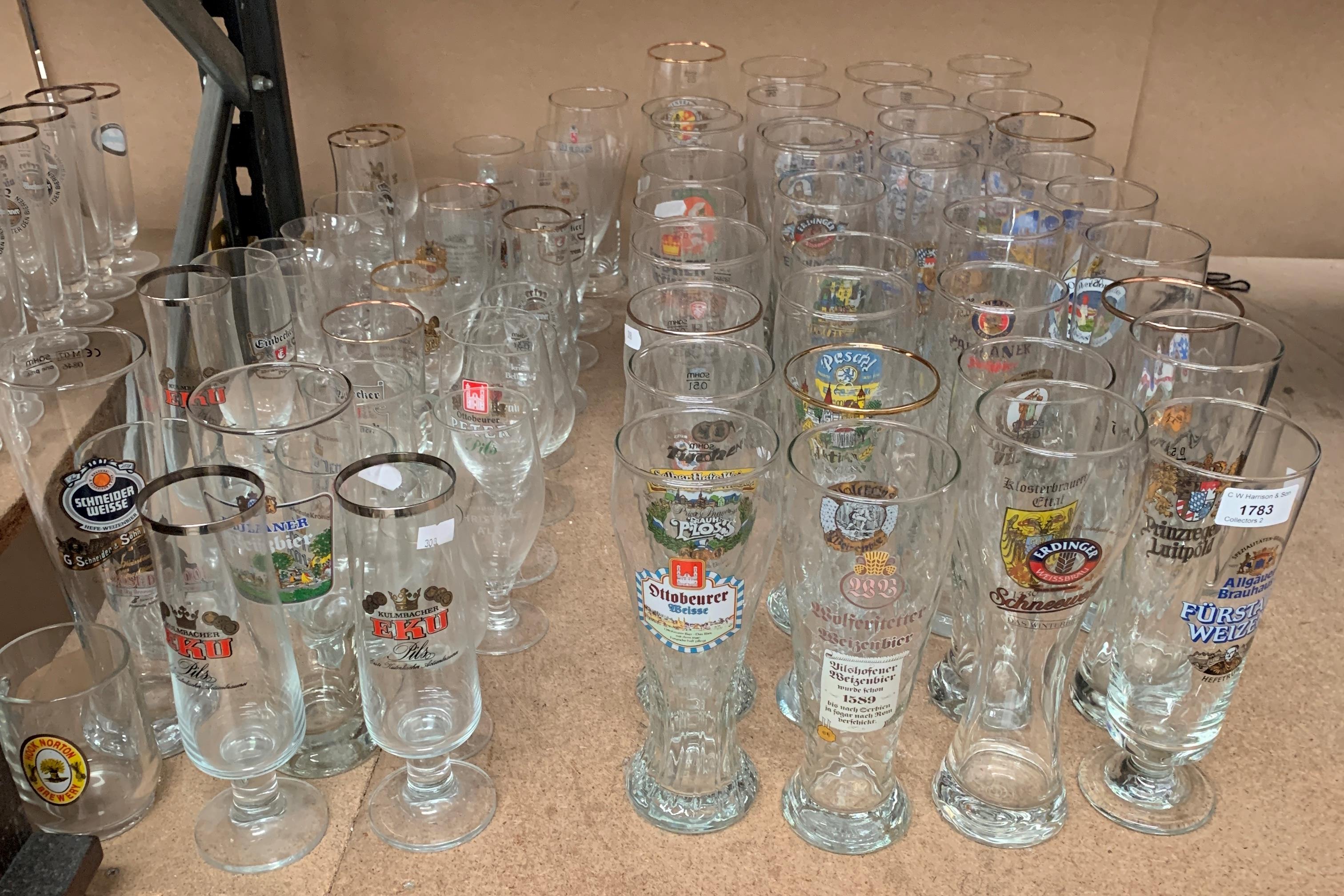 Contents to part of rack a large quantity of German beer drinking glasses in various shapes and