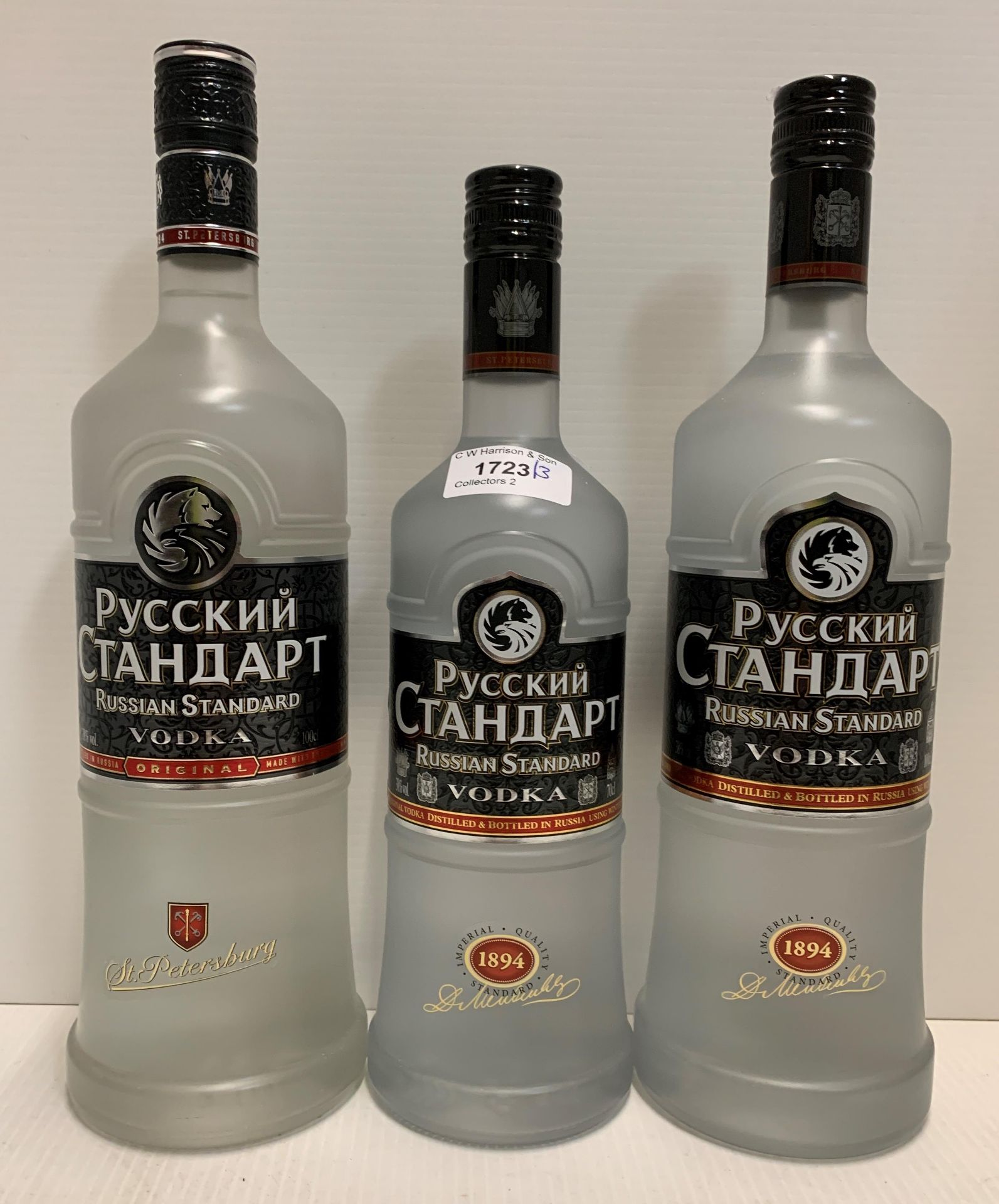 Two 100cl bottles of Pyccknn Ctahdapt Russian Standard Vodka (38% volume) and a 70cl bottle of the