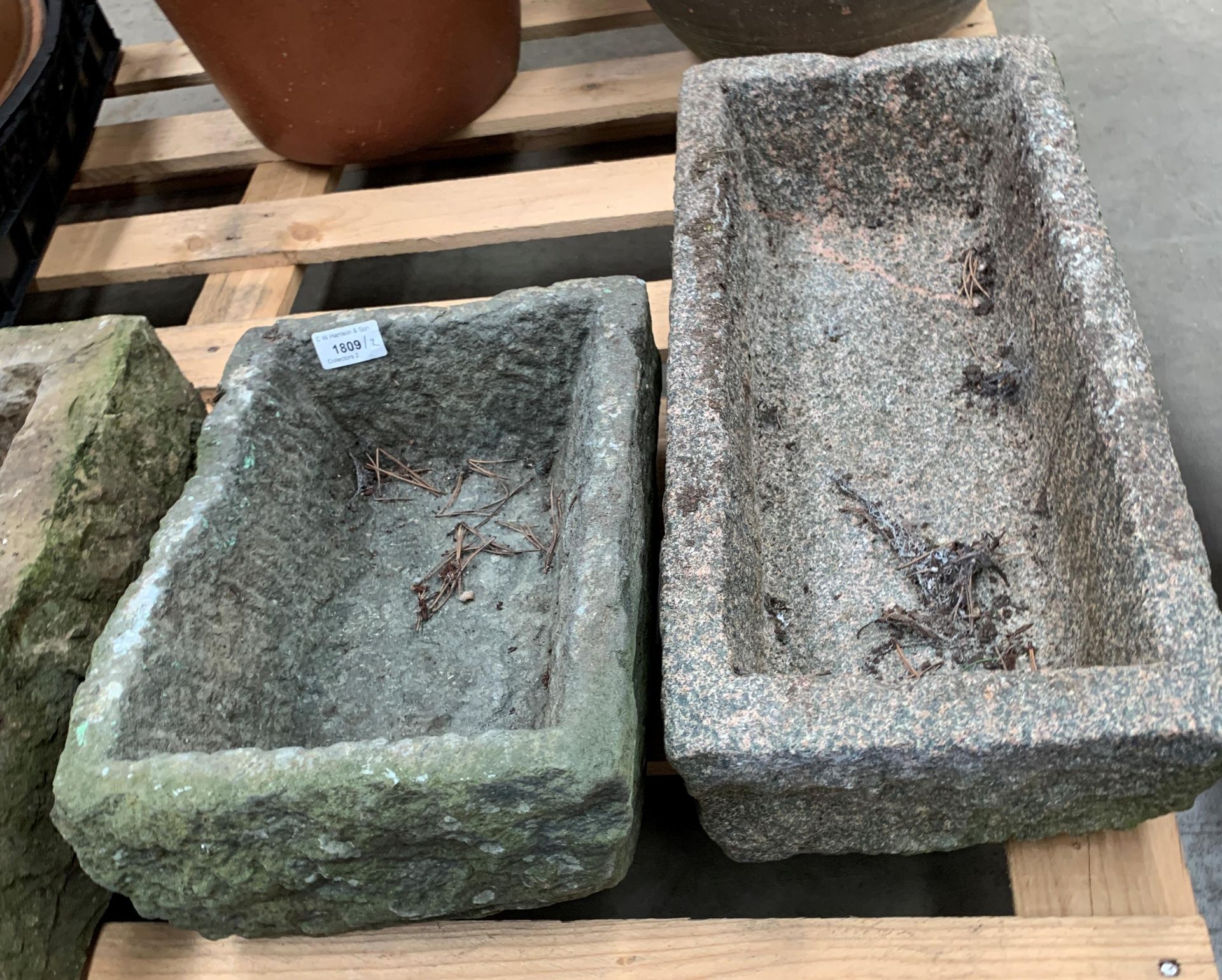 Two granite stone troughs the largest 48 x 23 x 15cm and the smaller 33 x 25 x 18cm