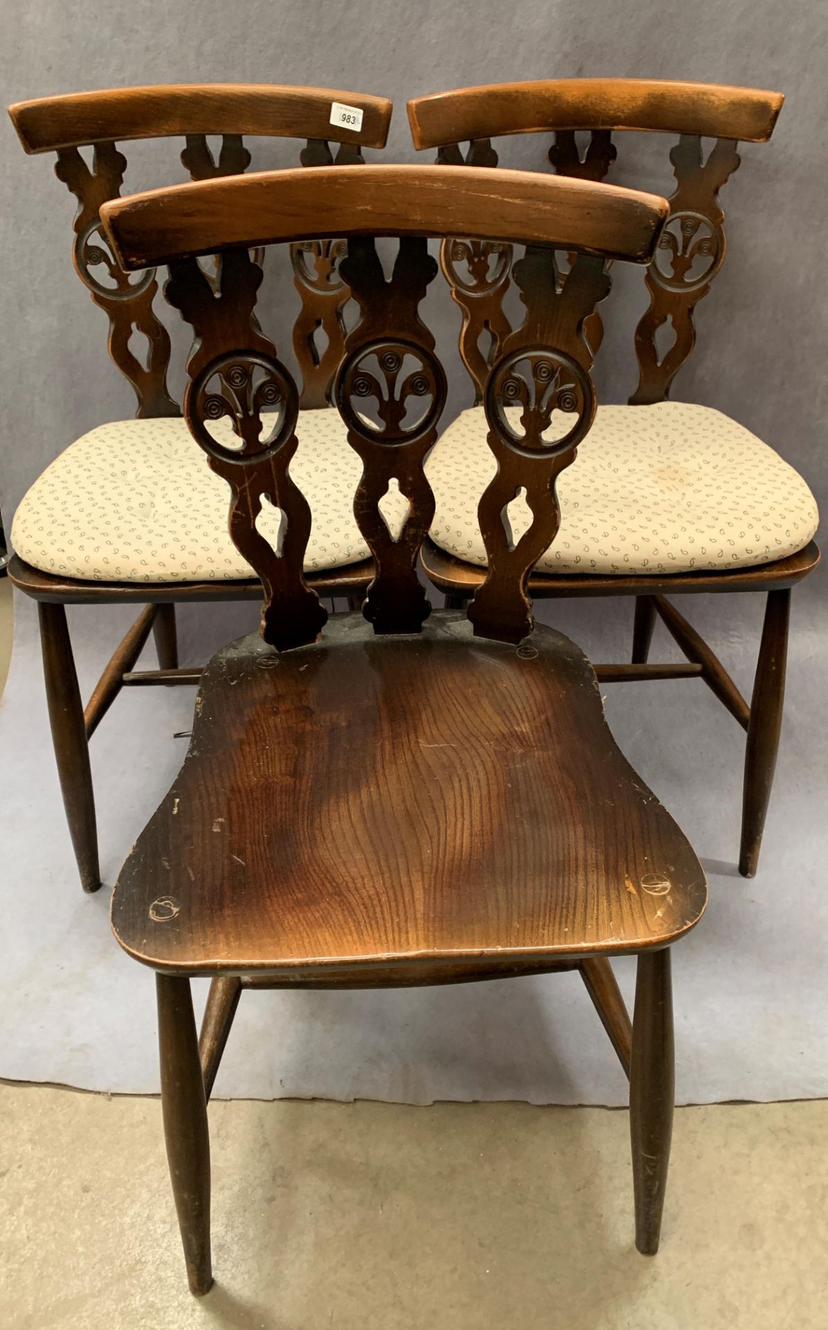 A set of six Ercol dark elm dining chairs,