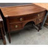 A Georgian mahogany bow fronted three drawer desk on turned legs - 102 x 49 x 77cm high