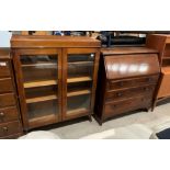 An early 20th century walnut bureau bookcase - the top now altered to a display cabinet making two