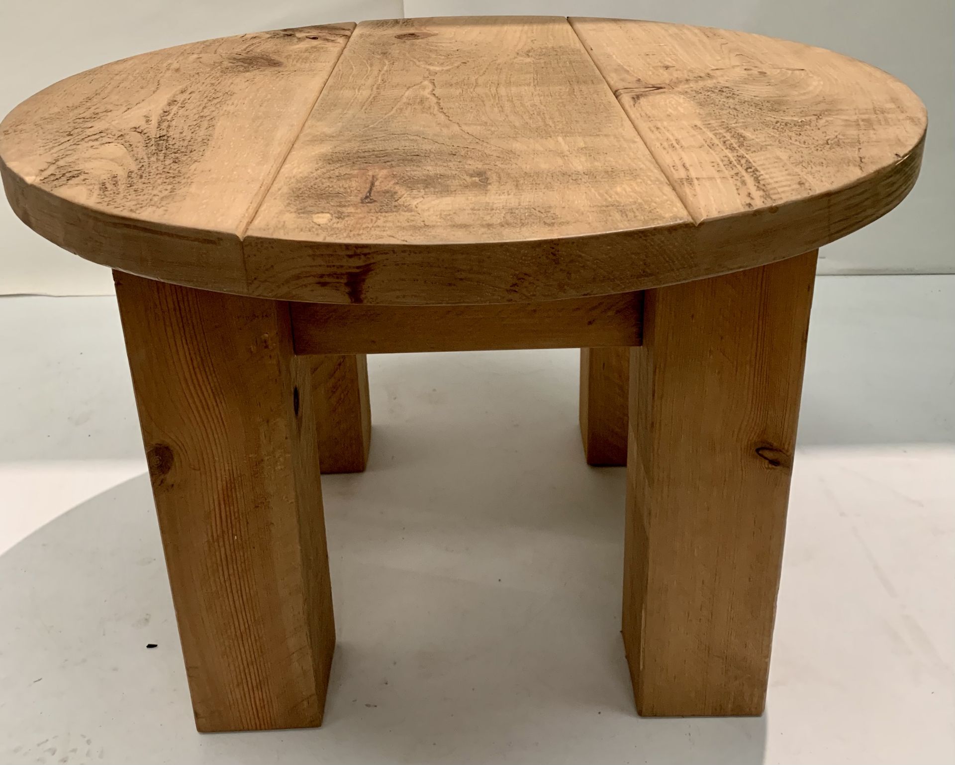 A 3 plank circular wooden coffee table 44cm high x 70cm diameter