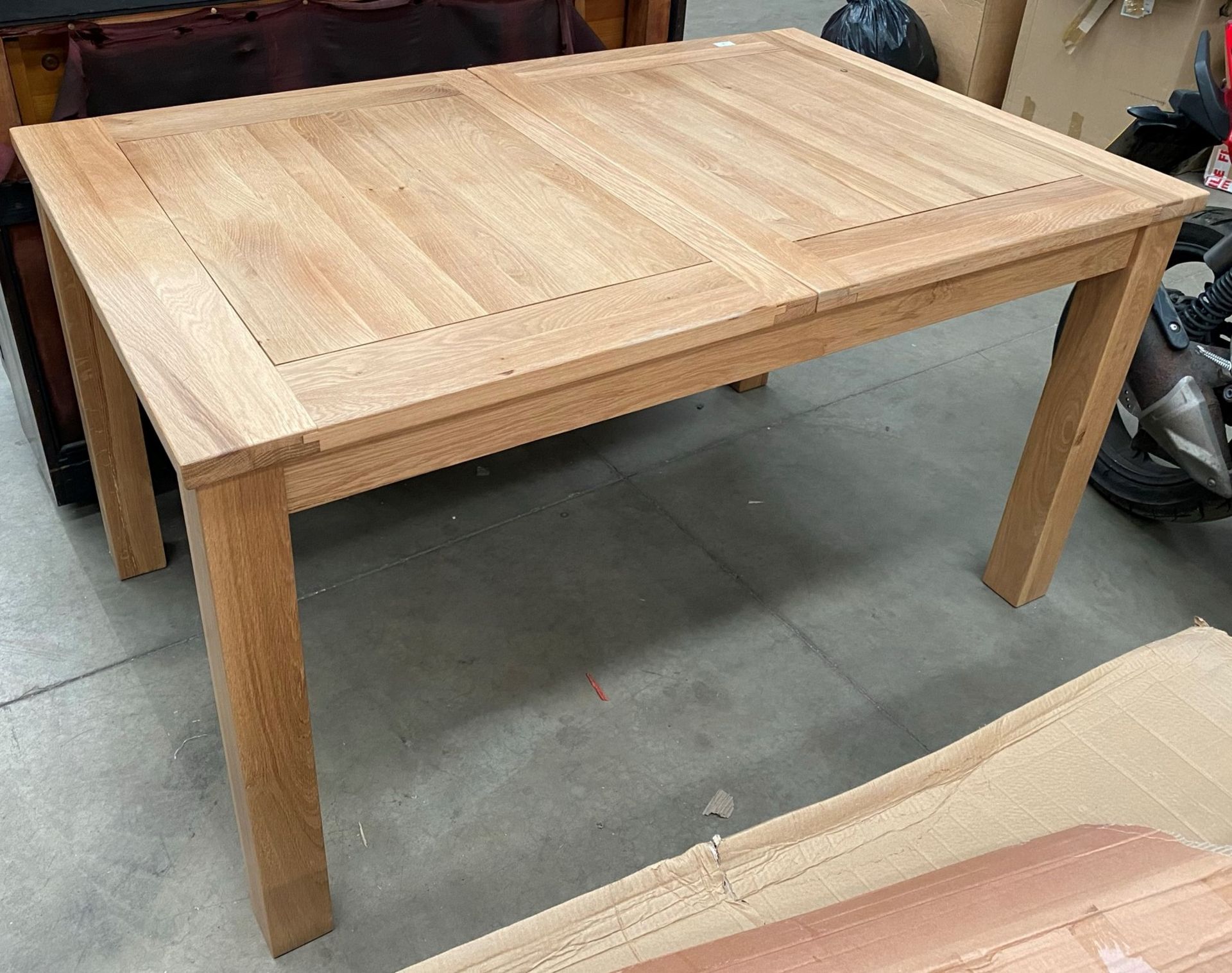 Natural oak extending dining table 142cm x 92cm with two extra leaves extending to approx 216cm