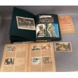 A post card album containing approximately 75 black and white and colour topographical and other