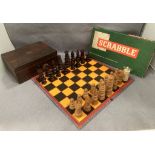 A wood chess set with one replacement castle and several pieces damaged complete with a walnut box