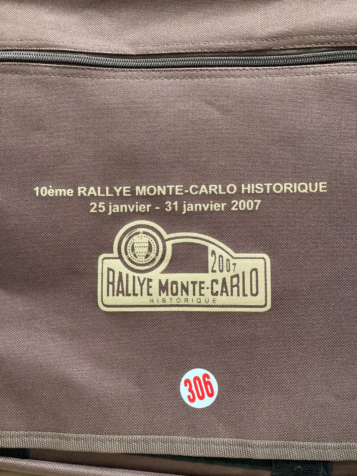 A Monte Carlo Rally brown canvas messenger bag and a small brown fibre suitcase containing a - Image 2 of 6