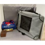 A folding portable dog/cat kennel 70 x 50 x 60cm when erected and a Superlube bag and contents -