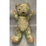 A play worn soft toy bear in need of some love - lacking one eye and tinged green 54cm long